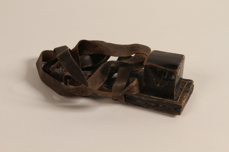 Tefillin worn by Alexander Kuechel during his time in a Nazi camp.